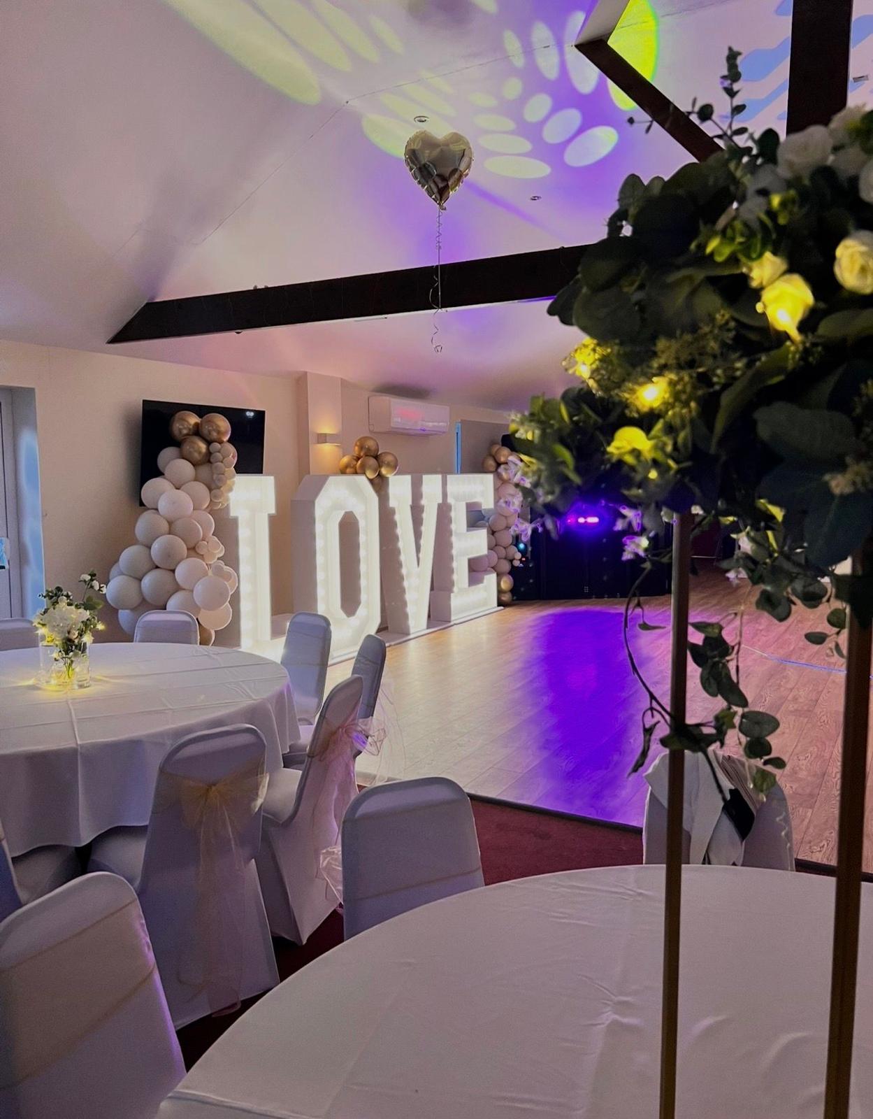 Dance floor with LOVE letters at an evening reception